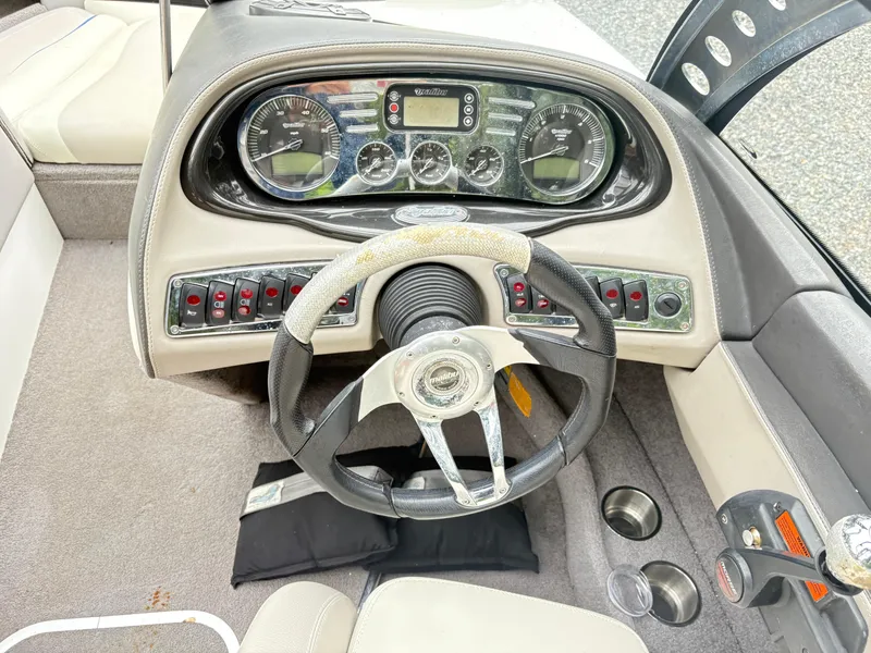 Slide: The Image of 2007 Malibu Wakesetter VTX dashboard with steering wheel and control panel. - 11