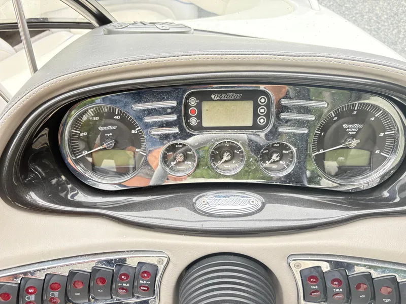 Slide: The Image of Dashboard of a 2007 Malibu Wakesetter VTX boat with gauges and controls. - 15