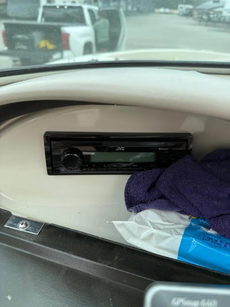 Slide: The Image of JVC stereo system in 2002 Sea Ray 176 Bow Rider boat dashboard. - 13