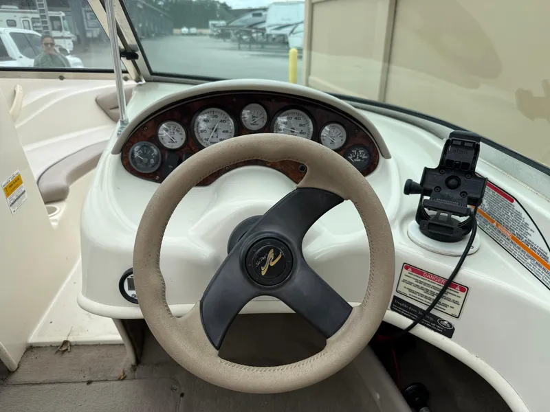 Slide: The Image of 2002 Sea Ray 176 Bow Rider dashboard with steering wheel and instrument panel. - 15