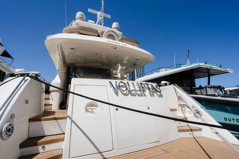 Slide: The Image of Luxury 2006 Aicon Flybridge yacht docked under clear blue sky. - 10