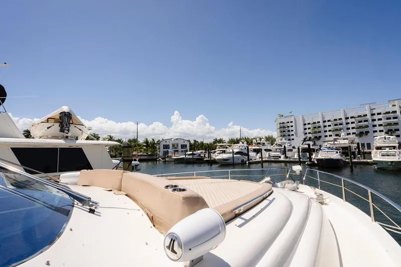 Slide: The Image of 2006 Aicon Flybridge yacht docked at marina under clear blue sky. - 19