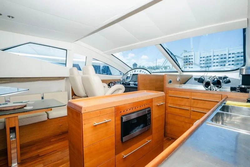 Slide: The Image of Luxurious 2006 Aicon Flybridge yacht interior with modern kitchen and seating area. - 46