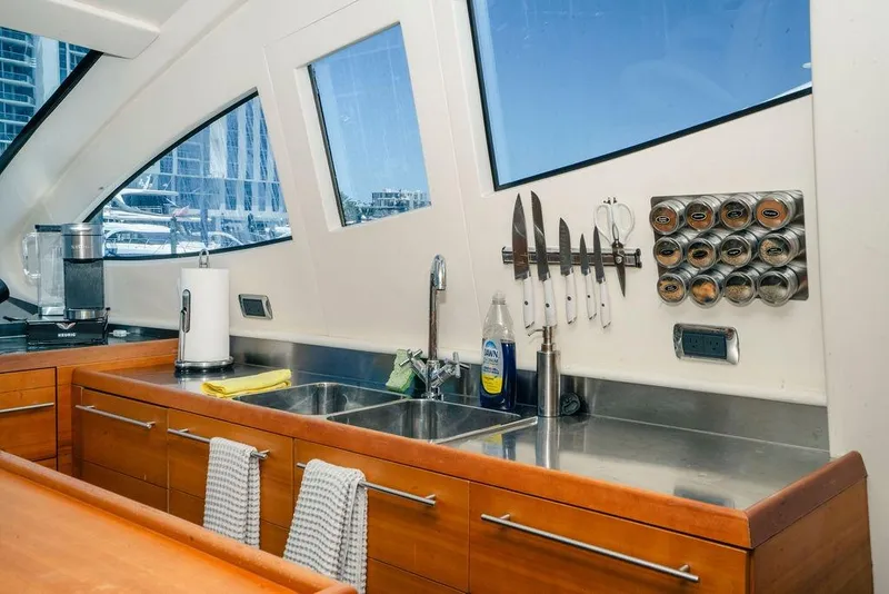 Slide: The Image of Modern kitchen interior on 2006 Aicon Flybridge yacht with stainless steel sink and knife rack. - 47