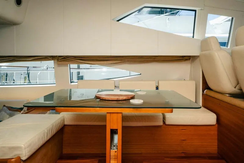 Slide: The Image of Interior of 2006 Aicon Flybridge yacht with elegant seating and glass table. - 51