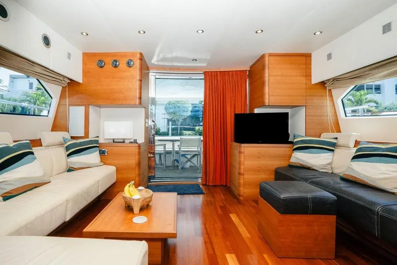 Slide: The Image of Luxurious interior of 2006 Aicon Flybridge yacht with modern furnishings and wooden accents. - 57