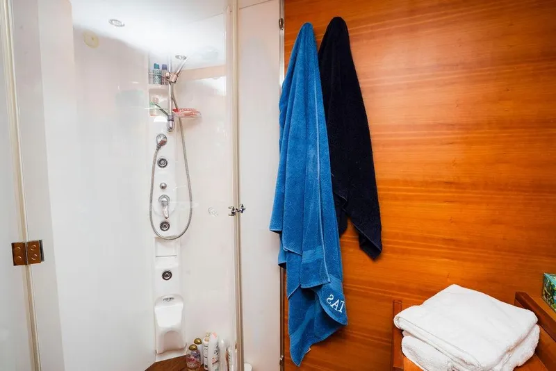 Slide: The Image of Luxurious bathroom in 2006 Aicon Flybridge yacht with modern shower and towels. - 61