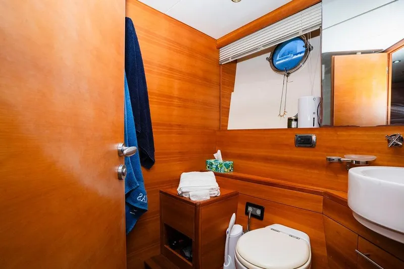 Slide: The Image of Luxurious 2006 Aicon Flybridge yacht bathroom with wooden interior and modern amenities. - 64