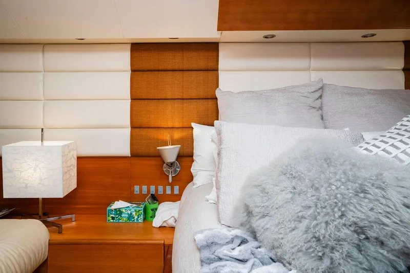 Slide: The Image of Luxurious bedroom interior on 2006 Aicon Flybridge yacht, featuring plush bedding and modern decor. - 78