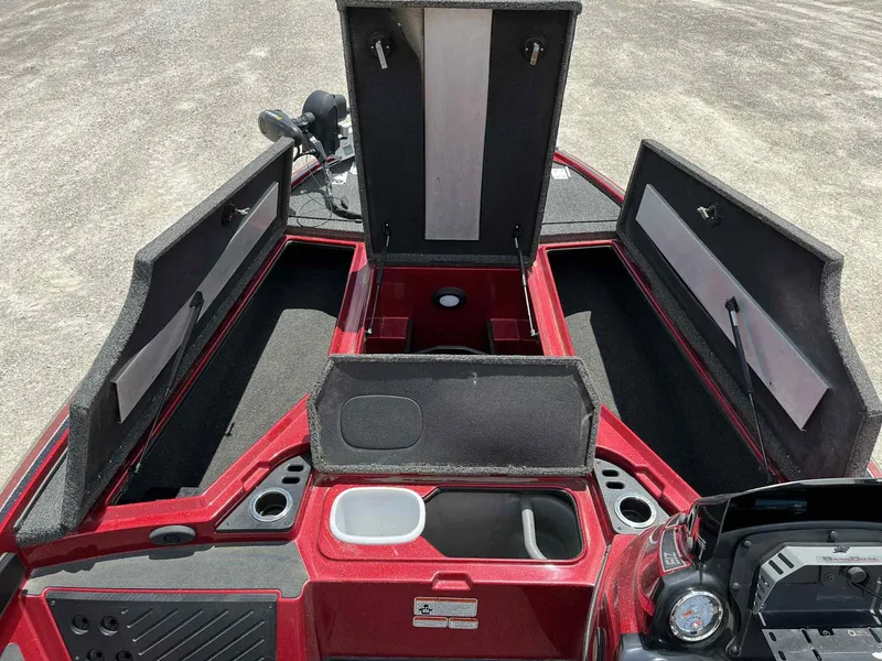 Slide: The Image of 2018 Nitro Z19 boat interior with open storage compartments and red finish. - 8