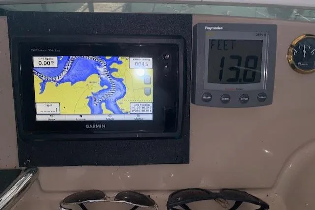 Slide: The Image of Navigation system on 2005 Carver 444 Cockpit Motor Yacht dashboard, showing map and depth. - 10