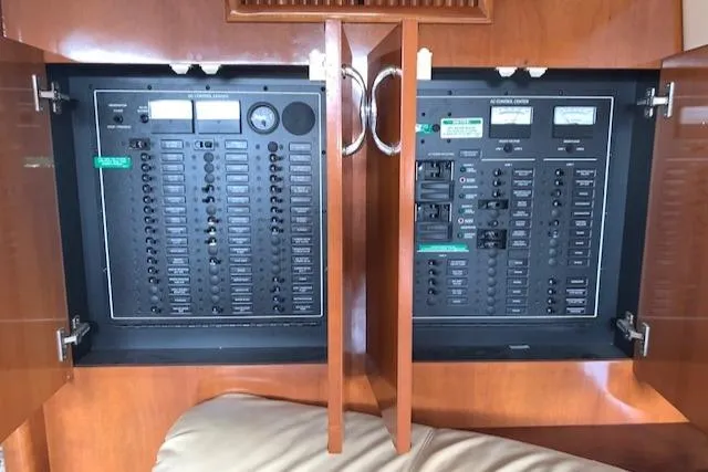 Slide: The Image of Electrical panel inside 2005 Carver 444 Cockpit Motor Yacht, featuring switches and controls. - 18