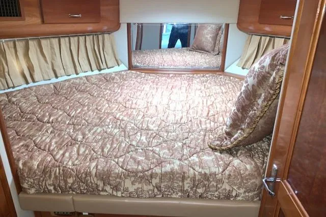 Slide: The Image of Luxurious bedroom interior of 2005 Carver 444 Cockpit Motor Yacht with elegant bedding. - 22
