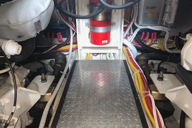 Slide: The Image of Engine room of 2005 Carver 444 Cockpit Motor Yacht with wiring and equipment. - 30