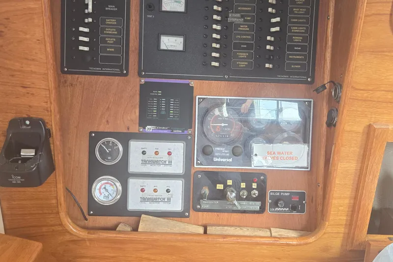 Slide: The Image of Control panel of a 1987 Saturna 33 boat with gauges and switches. - 16
