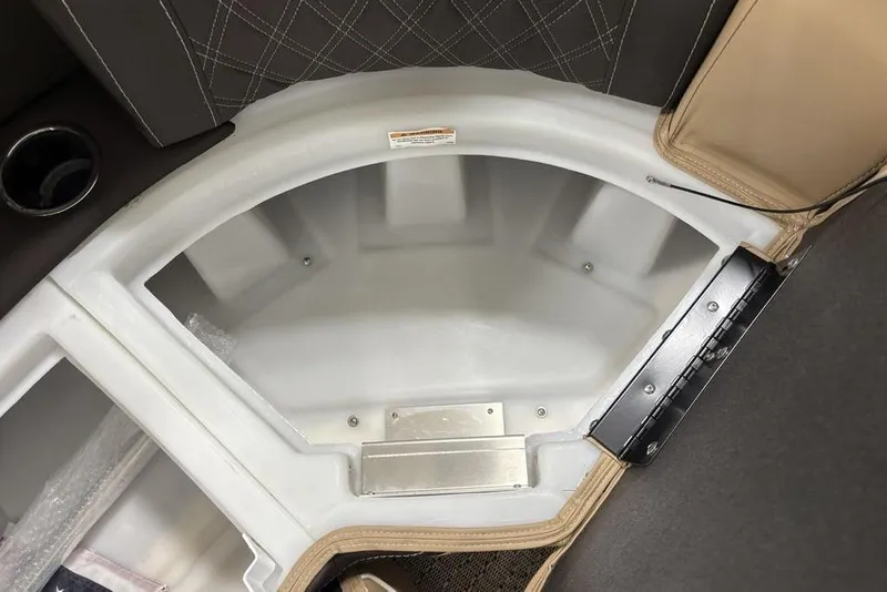 Slide: The Image of 2025 Barletta L25U boat interior with beige seating and black panel. - 18