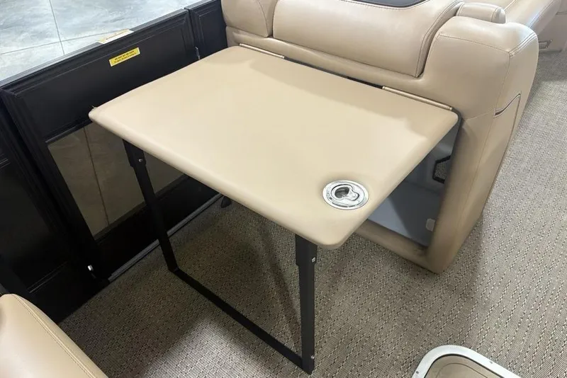 Slide: The Image of 2025 Barletta L25U boat seating with beige and gray upholstery, featuring cup holders. - 23