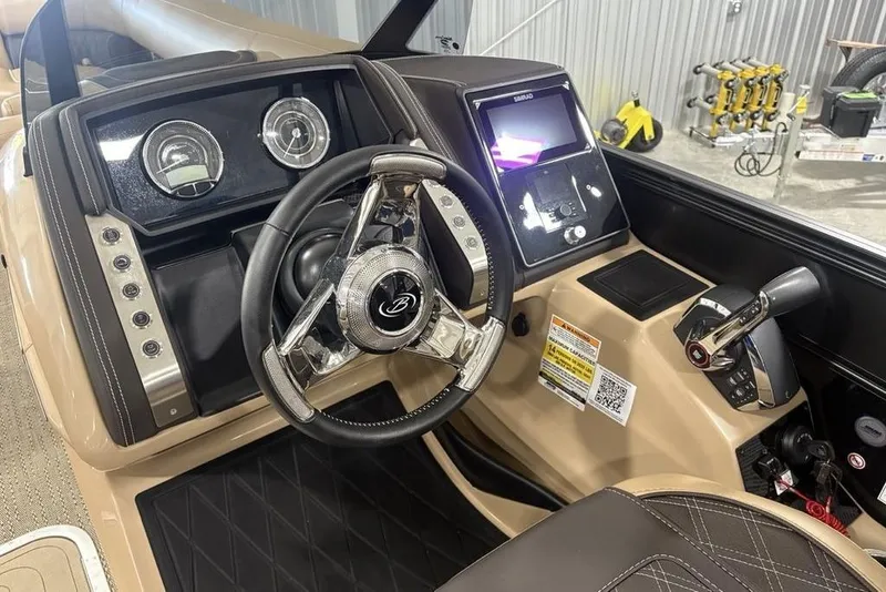 Slide: The Image of Control panel of 2025 Barletta L25U boat with labeled buttons and leather trim. - 26