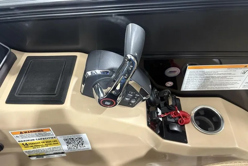 Slide: The Image of 2025 Barletta L25U boat interior with luxurious captain's chair and steering wheel. - 27