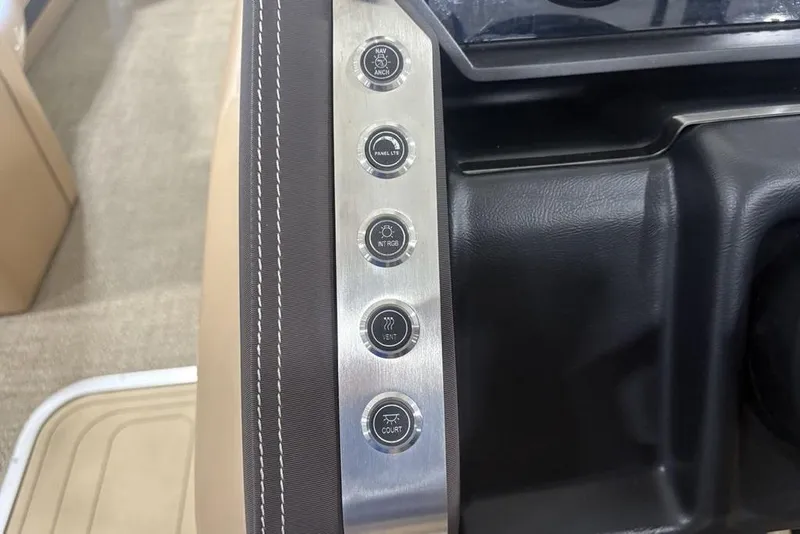 Slide: The Image of Control panel of 2025 Barletta L25U boat featuring Simrad and JBL systems. - 28