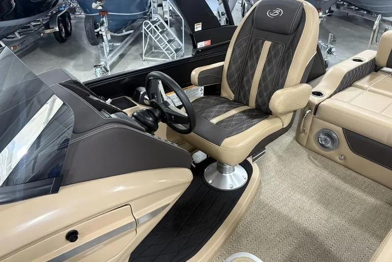 Slide: The Image of 2025 Barletta L25U boat interior with beige and black cushioned seating. - 29
