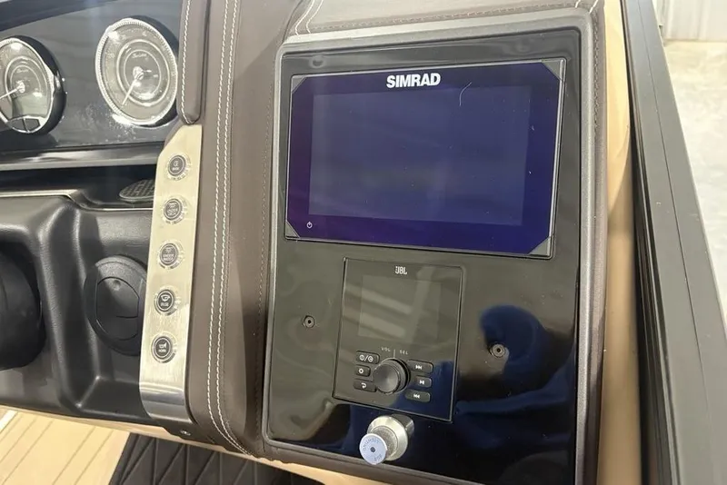 Slide: The Image of 2025 Barletta L25U boat interior with beige seating and storage compartment. - 30