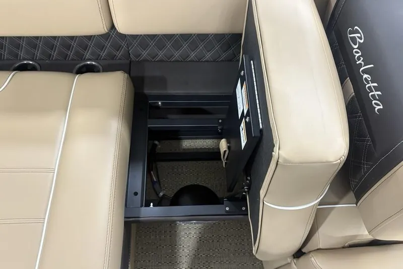 Slide: The Image of 2025 Barletta L25U boat interior with beige seating and cup holders. - 32