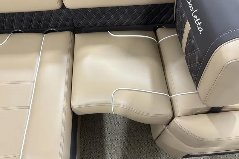 Slide: The Image of Luxurious seating on 2025 Barletta L25U pontoon boat, featuring beige upholstery and cup holders. - 33