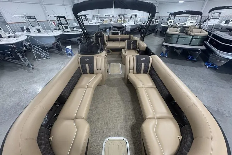 Slide: The Image of Barletta L25U 2025 boat floor hatch with textured carpet and speaker detail. - 40