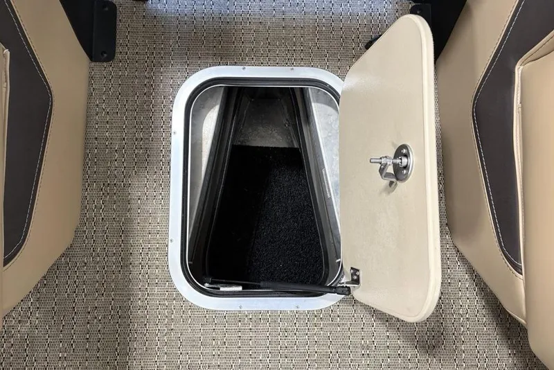 Slide: The Image of Luxurious seating on 2025 Barletta L25U boat, featuring tan upholstery and storage compartment. - 7