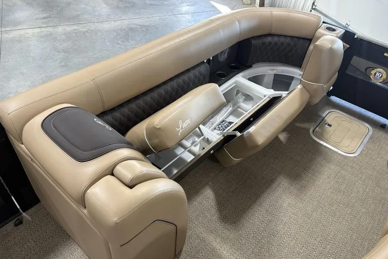 Slide: The Image of Storage compartment in 2025 Barletta L25U boat with red and black bags. - 9