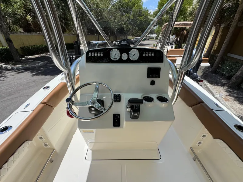 Slide: The Image of 2026 Pioneer 202 Sportfish boat console with steering wheel and controls. - 11