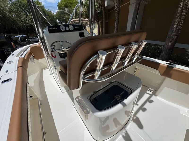 Slide: The Image of 2026 Pioneer 202 Sportfish boat interior with rod holders and console. - 7