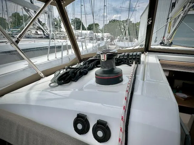 Slide: The Image of Jeanneau Sun Odyssey 440 sailboat deck, featuring winch and ropes, 2023 model. - 18