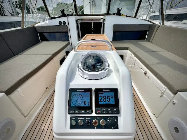 Slide: The Image of 2023 Jeanneau Sun Odyssey 440 cockpit with navigation instruments and seating. - 20