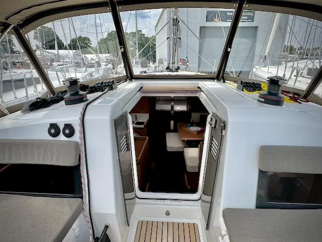 Slide: The Image of Interior view of 2023 Jeanneau Sun Odyssey 440 sailboat cockpit and cabin entrance. - 24