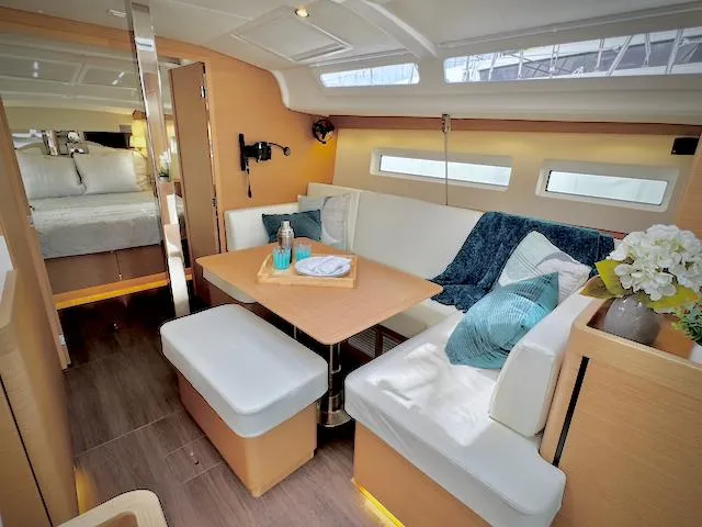 Slide: The Image of Luxurious interior of 2023 Jeanneau Sun Odyssey 440 sailboat with cozy seating and modern decor. - 27
