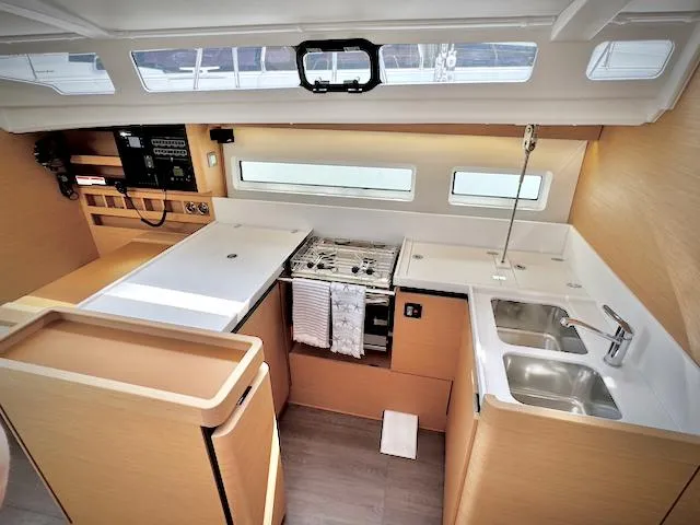 Slide: The Image of Modern kitchen in 2023 Jeanneau Sun Odyssey 440 yacht with sleek design and ample storage. - 30
