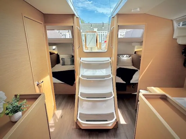 Slide: The Image of Interior of 2023 Jeanneau Sun Odyssey 440 sailboat, featuring modern design and twin cabins. - 38