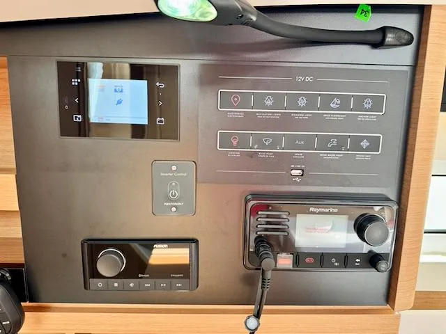 Slide: The Image of Control panel of 2023 Jeanneau Sun Odyssey 440 yacht with navigation and communication systems. - 42