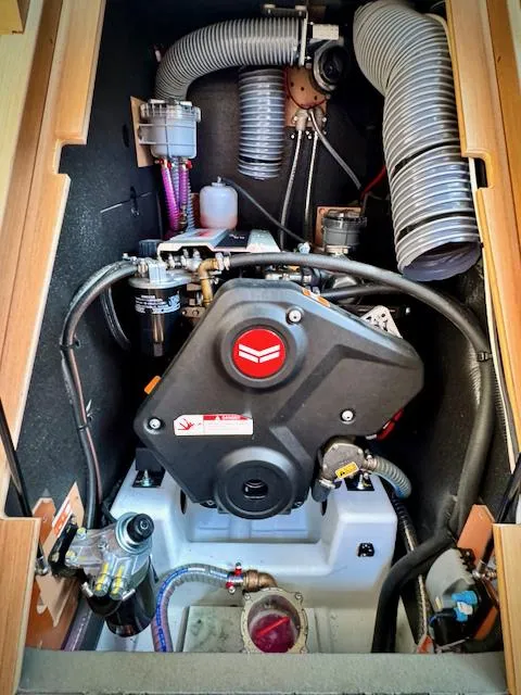 Slide: The Image of Engine compartment of 2023 Jeanneau Sun Odyssey 440 sailboat, showcasing mechanical components. - 45