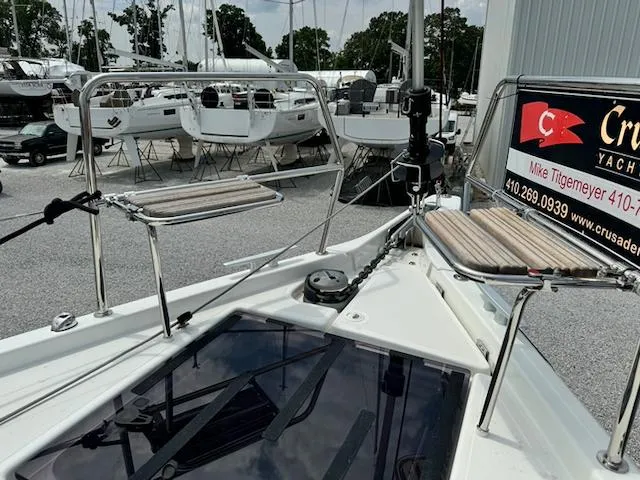 Slide: The Image of 2023 Jeanneau Sun Odyssey 440 yacht deck at marina, showcasing sleek design and modern features. - 5