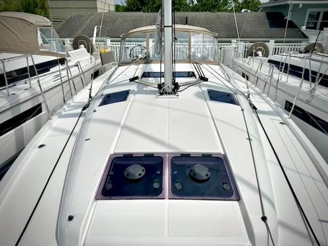 Slide: The Image of 2023 Jeanneau Sun Odyssey 440 sailboat deck with sleek design and modern features. - 7