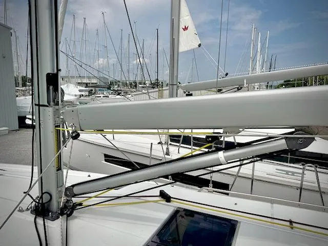 Slide: The Image of 2023 Jeanneau Sun Odyssey 440 sailboat mast and rigging in marina. - 8
