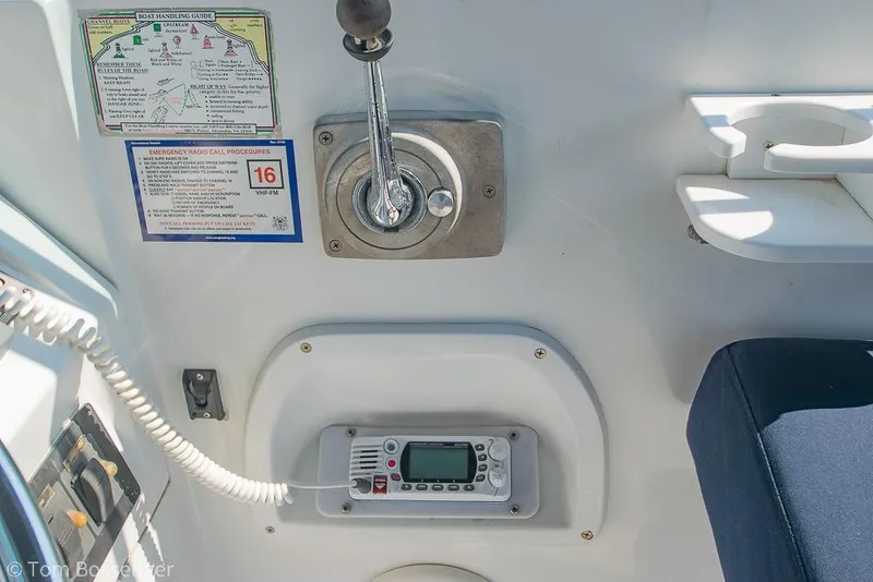 Slide: The Image of 1999 Mainship Pilot 30 cockpit controls with radio and navigation instructions. - 29