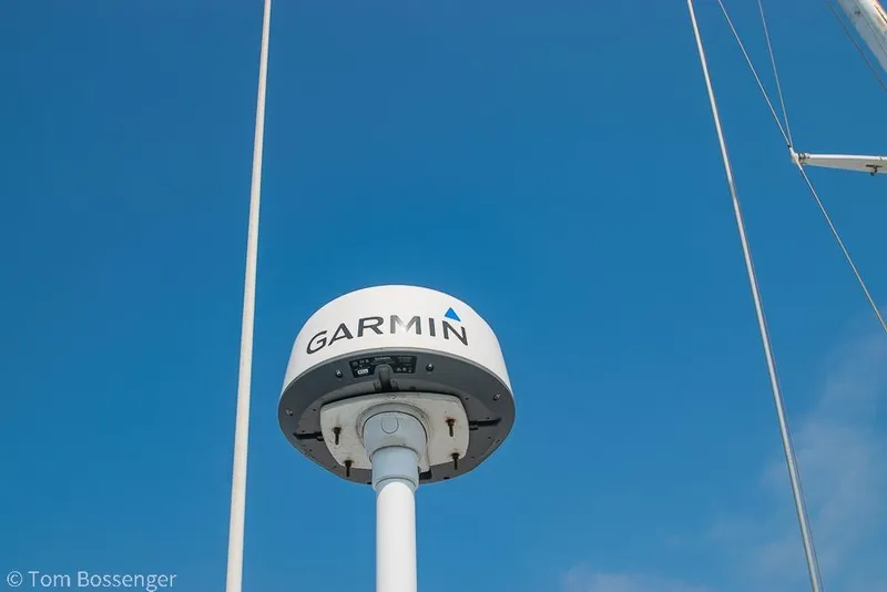 Slide: The Image of Garmin radar on 1999 Mainship Pilot 30 boat against clear blue sky. - 33