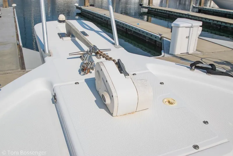 Slide: The Image of 1999 Mainship Pilot 30 boat deck with anchor chain and dock view. - 35