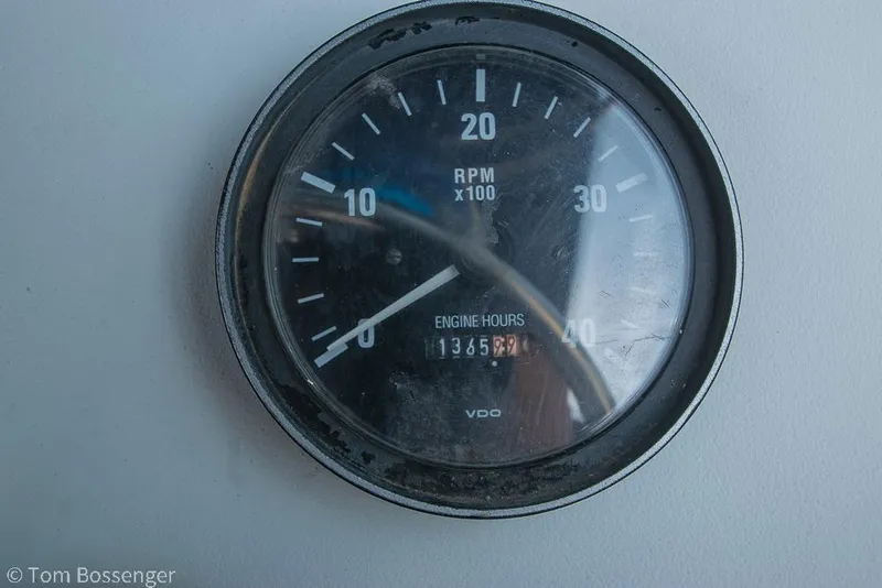 Slide: The Image of Close-up of a tachometer showing engine hours on a 1999 Mainship Pilot 30. - 41