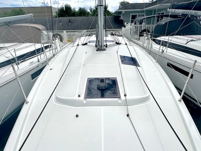 Slide: The Image of 2024 Jeanneau Sun Odyssey 410 sailboat deck view at marina. - 10