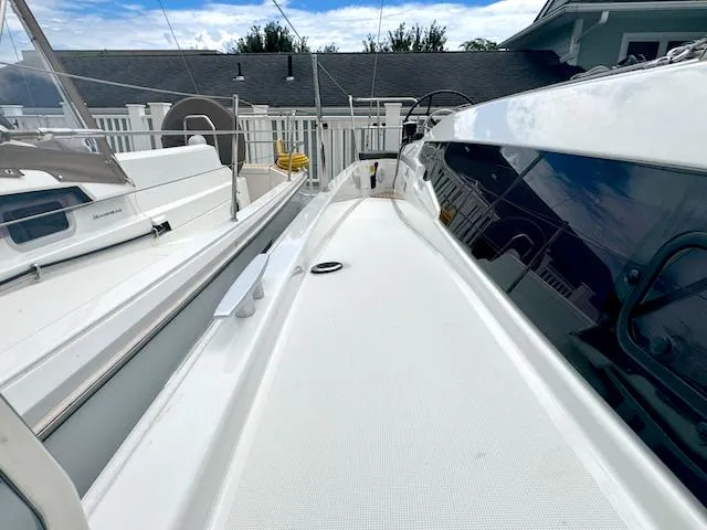 Slide: The Image of 2024 Jeanneau Sun Odyssey 410 deck view, showcasing sleek design and modern features. - 11